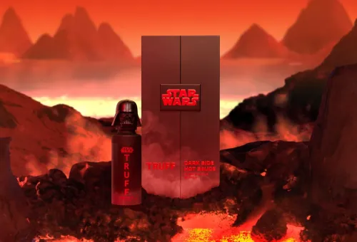 Truff's Star Wars Dark Side hot sauce: a Darth Vader-shaped black bottle beside its red Star Wars packaging, set against a fiery lava landscape